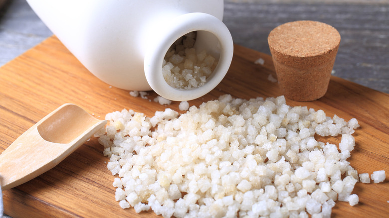 Epsom salt scattered on wooden board