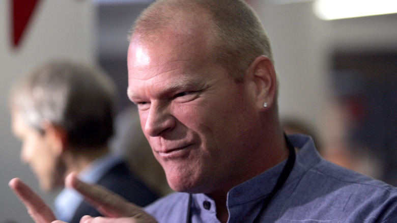 Mike Holmes in blue shirt