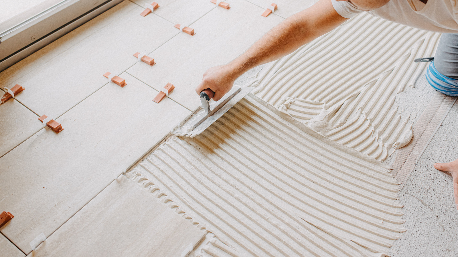 Use A Tile Thumper To Lay Tiles Evenly Without All The Extra Work