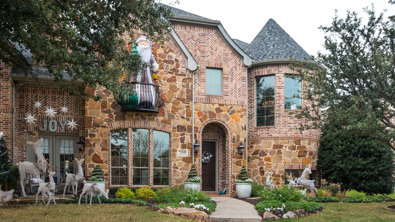 A house with turrets and small balconies similar to a European or Dallas Eclectic
