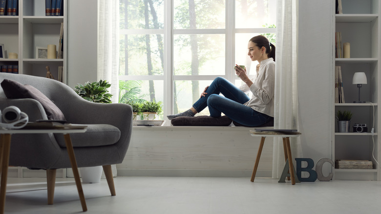 Person sitting on window