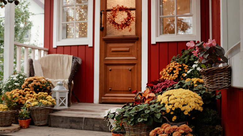 Front porch decorated with autumnal items