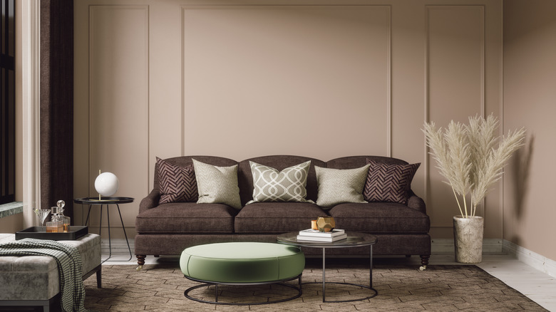 Brown sofa and tan walls