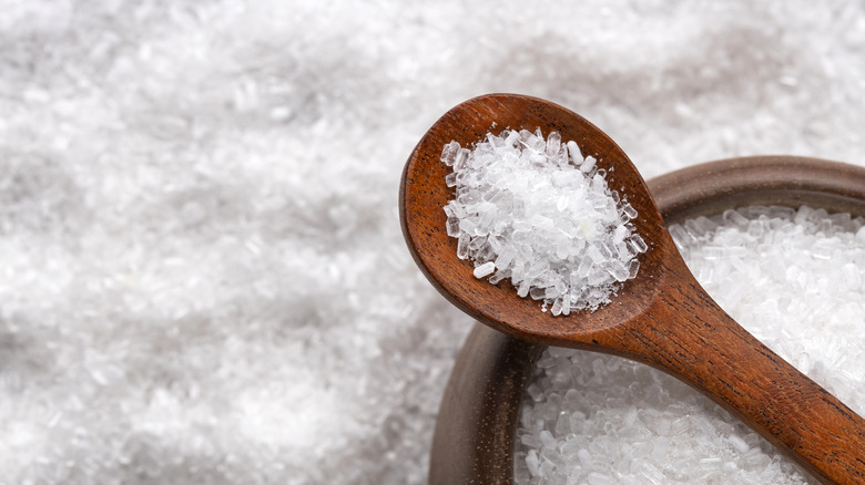 Epsom salts in bowl and wooden spoon