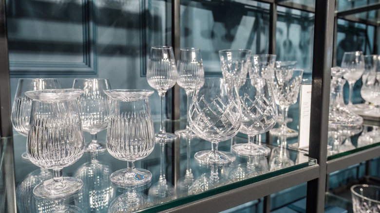 Waterford crystal stemware displayed on glass shelves