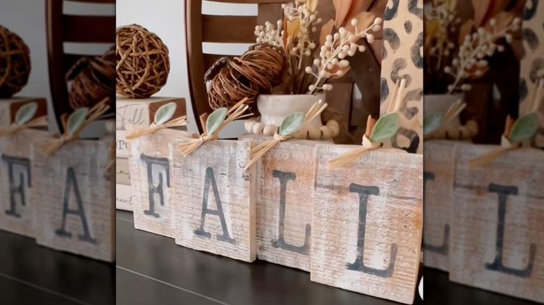 A DIY wooden sign that says "Fall."
