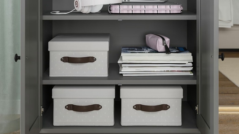 The IKEA BLADDRARE box half open in an under-the-bed drawer.