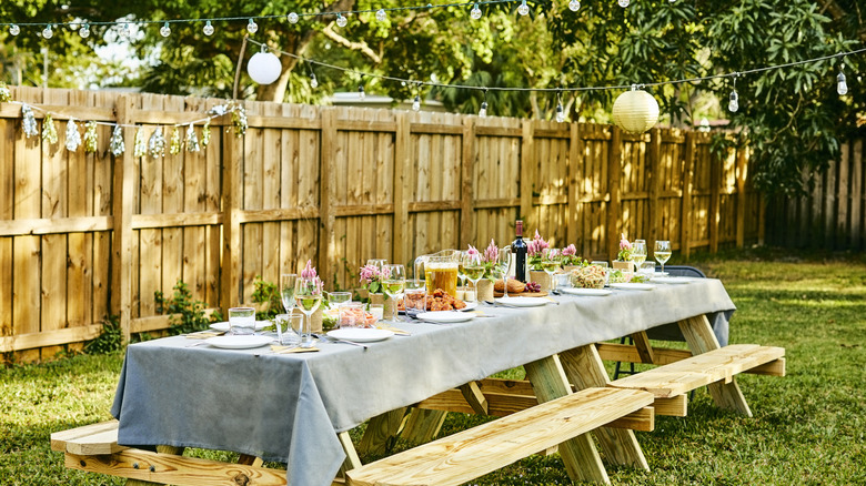 yard with wooden fence and variety of plants