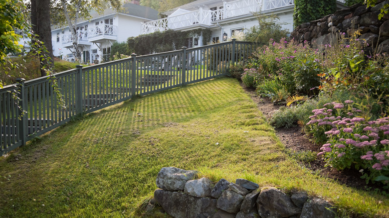 A home with a garden on a sloped backyard