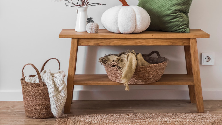 woven basket with blanket near table