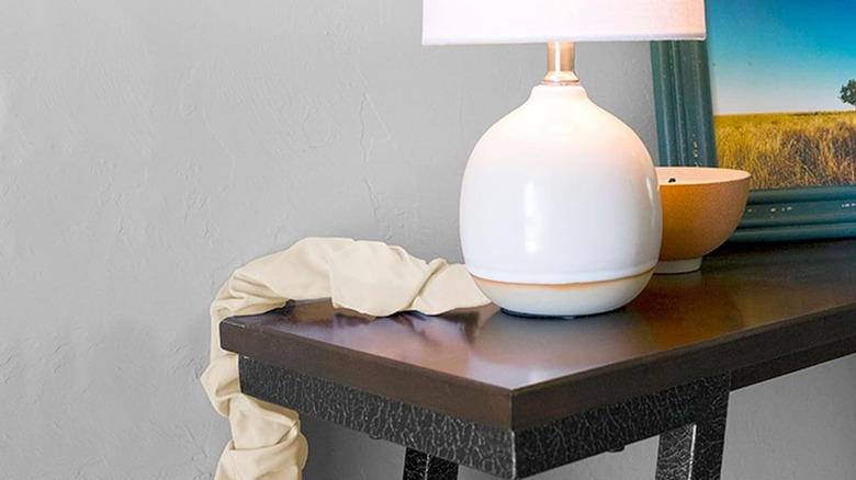 Fabric cord cover hiding lamp cord