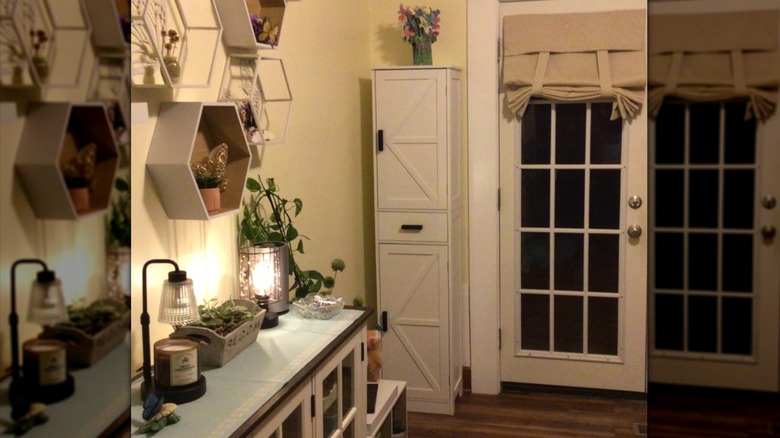 A white Weefon six-shelve 67-inch storage cabinet in home setting in the corner