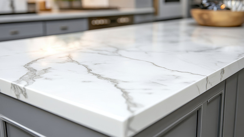 A modern kitchen island with a marble countertop