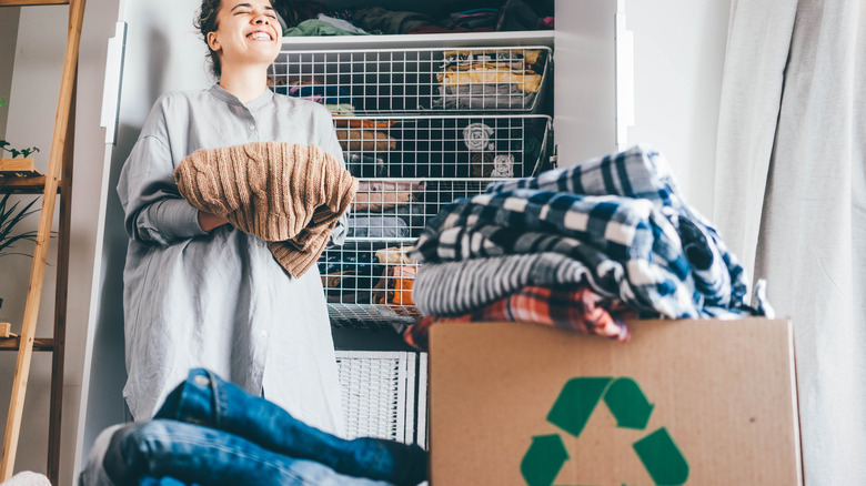 woman happily organizing her closet