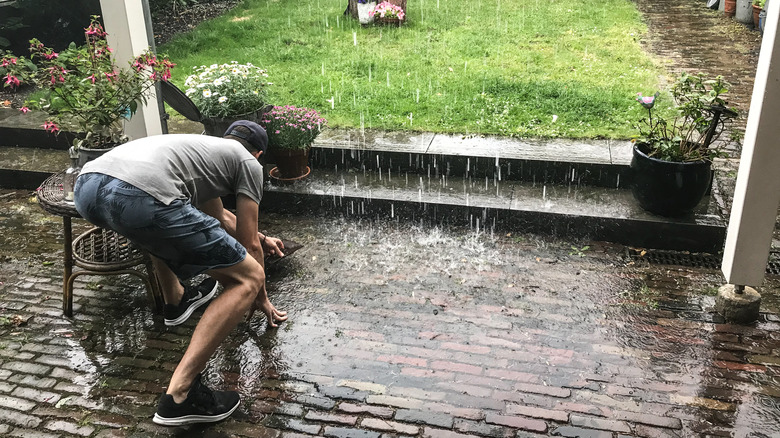 Man outside in rain