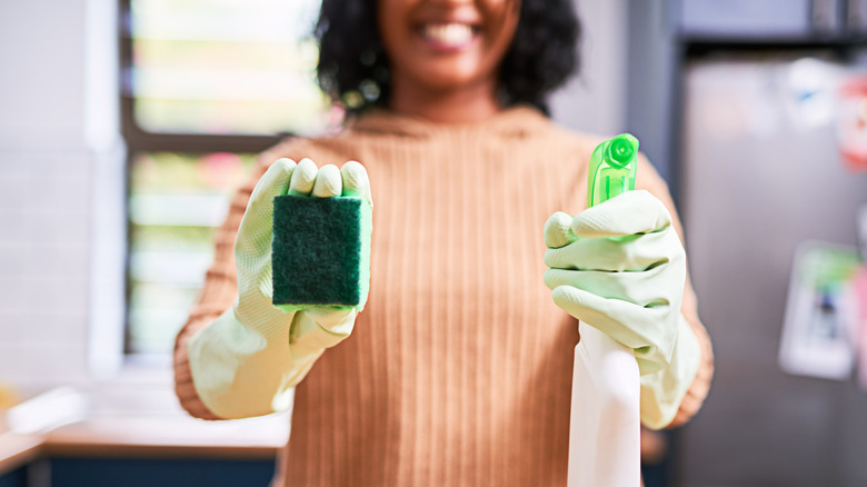 Woman preparing to clean kitchen