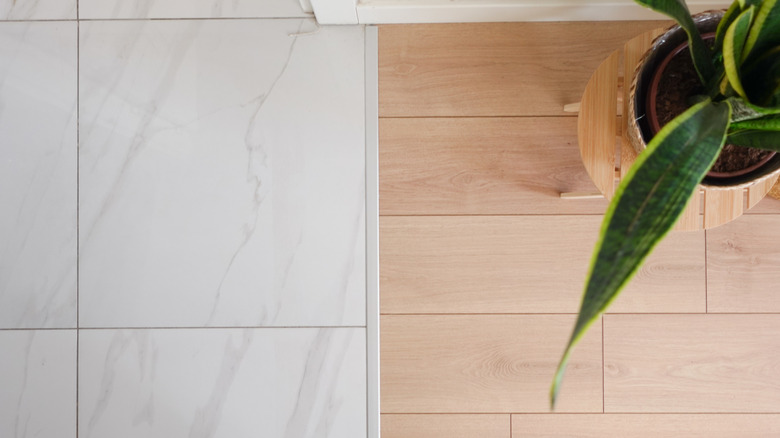 Tile flooring transitioning to wood floors