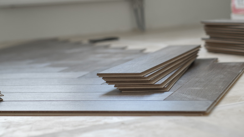 A small stack of flooring planks waiting to be installed