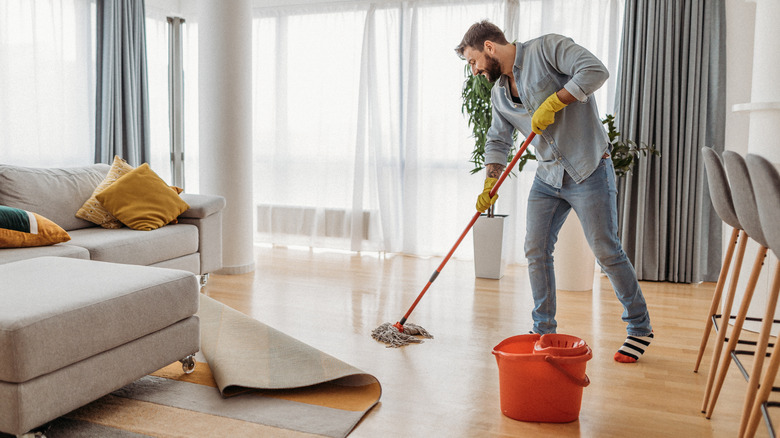 man mopping floors