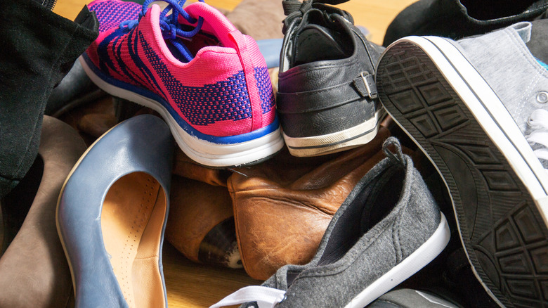 Cluttered shoes on floor