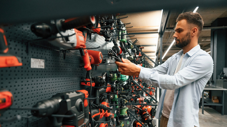man shopping for power tools