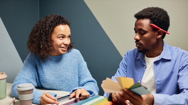 Couple picking out colors and patterns for their interior