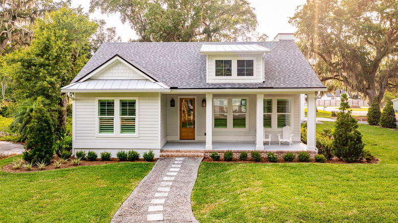 The front of a house with a walkway leading to the door