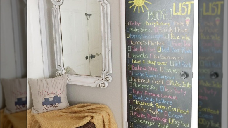 Child's closet door is turned into a blackboard with a summer bucket list written on it in colorful chalk