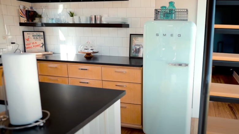 Retro seafoam fridge in a kitchen