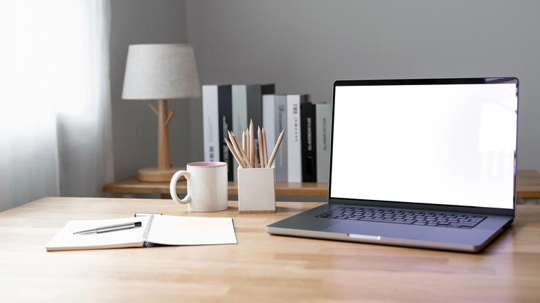 laptop open in home office