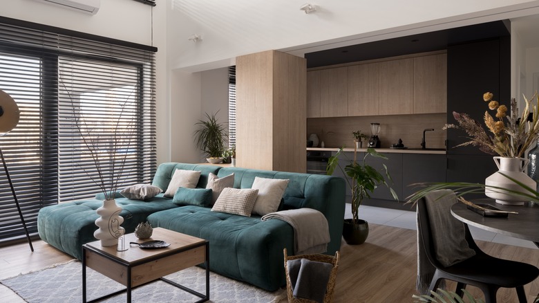 Light walls against blue couch