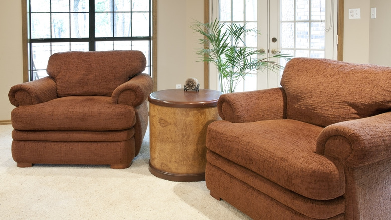 Two large rust-colored armchairs in a living room