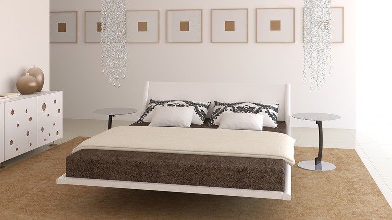 A floating bed with a white frame.