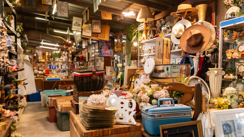 A thift store full of containers, frames, and garden decor.