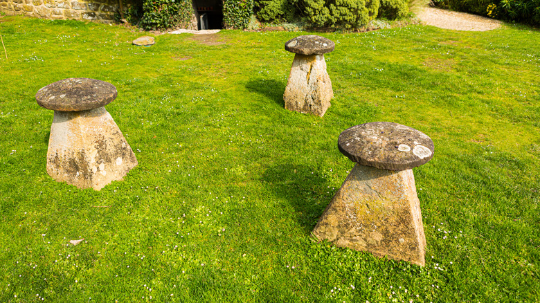 Three staddle stones in a triangle formation.