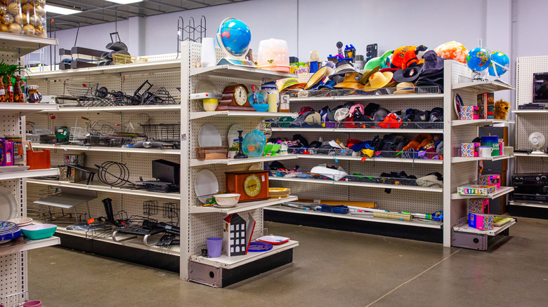 Thrift store shelves full of items