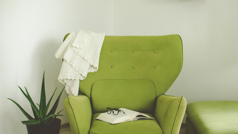Open book on a green armchair