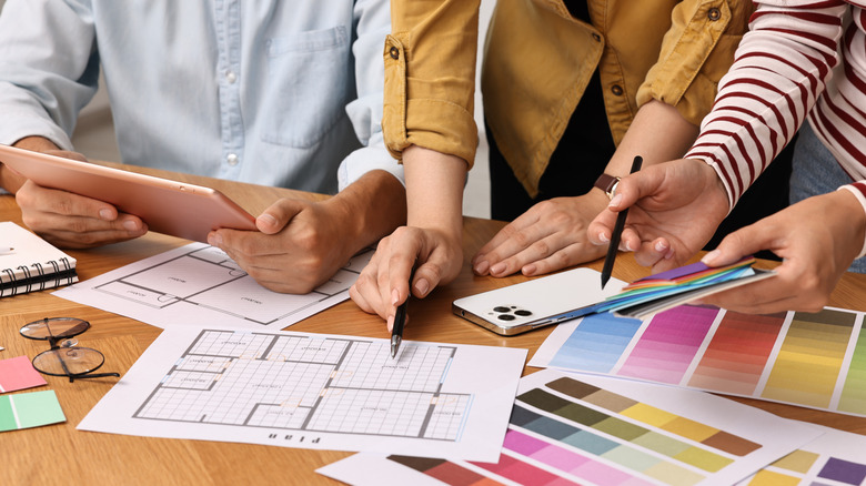 Interior designers working with color palettes