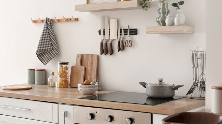 Interior of kitchen showing countertop and shelves