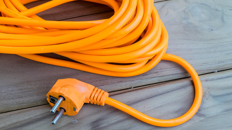 Orange extension cord on deck