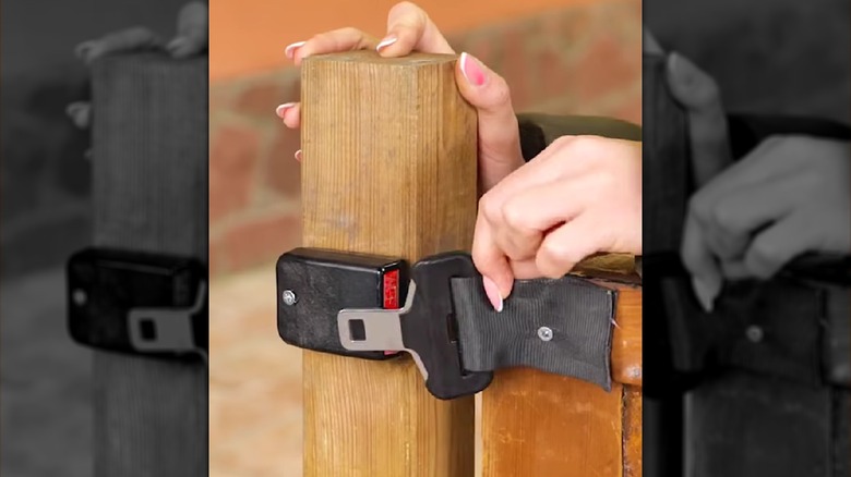 A seat belt tongue and buckle used as a gate latch.