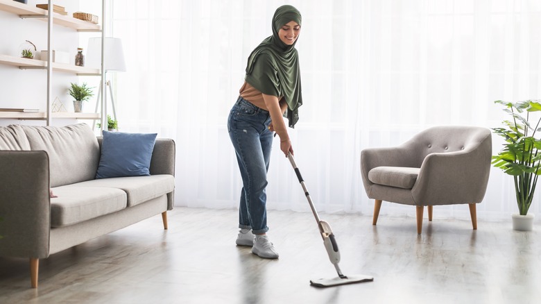 woman with swiffer wet mop