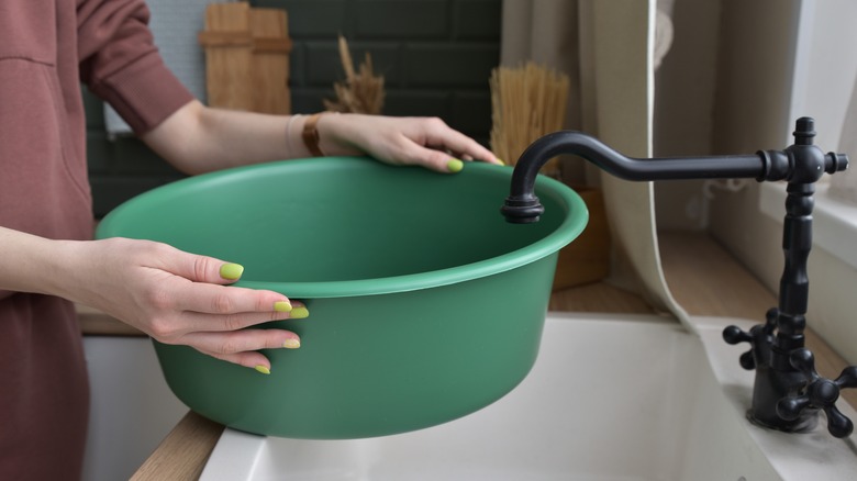 Person filling basin