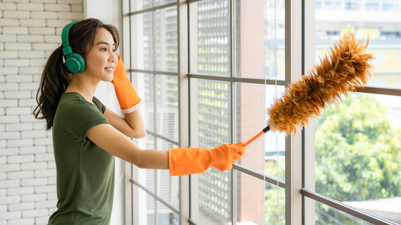 Woman with feather duster