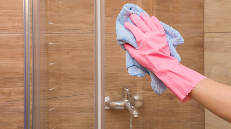 rubber gloves cleaning glass shower