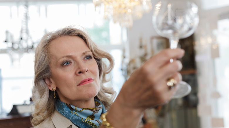 A woman shopping for glassware
