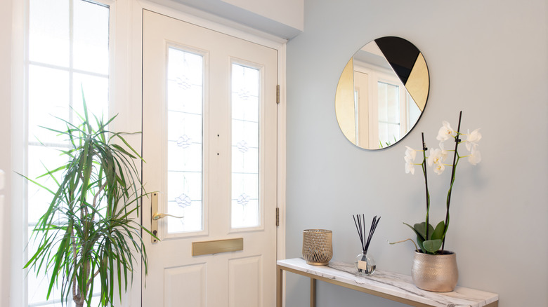 Pretty blue entryway with light décor