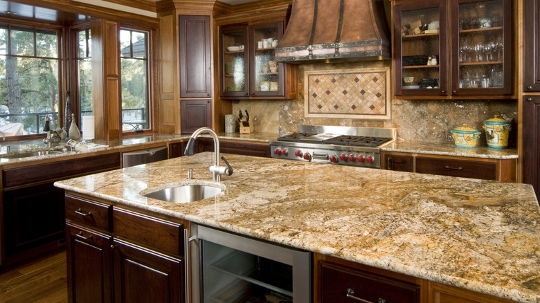 beige and gold granite countertop on central kitchen island