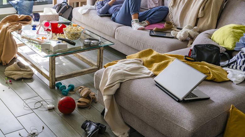 Dirty living room with food on the table