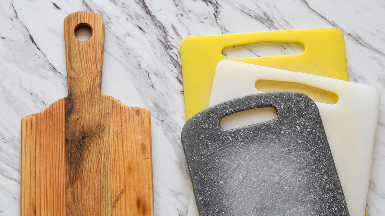 Cutting boards lying on a countertop.